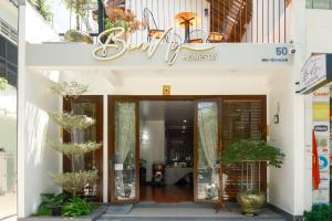 a entrance to a building with a sign on it at Benny Homestay Huế in Hue