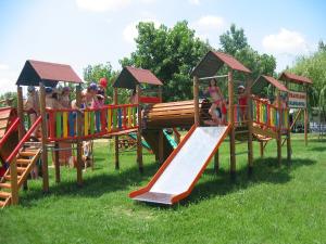 a group of children playing on a playground at Badiaccia Village Camping in Castiglione del Lago