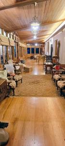 a large living room with wooden floors and furniture at Milntown Kaynes in Wellington Town