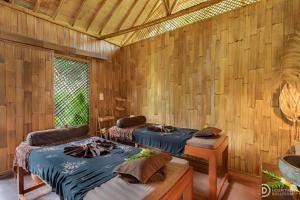 Postel nebo postele na pokoji v ubytování Bila Penida Resort & Farm
