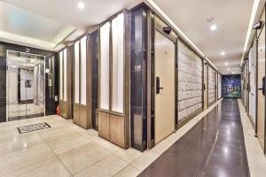 a hallway with glass doors in a building at Suwon Hotel Avenue in Hagwanggyo-dong