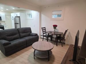 a living room with a couch and a table at 2bdrm Fairbanks Apt Great Location in Fairbanks