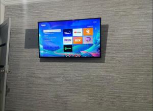 a flat screen tv hanging on a wall at House in a central area in Puerto Peñasco