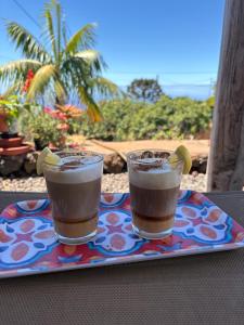 two drinks sitting on a plate on a table at Pino Redondo in Puntagorda