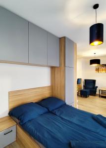 Ένα ή περισσότερα κρεβάτια σε δωμάτιο στο Apartament Paryski CENTRUM #nestapartamenty