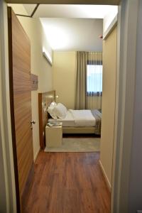 Voodi või voodid majutusasutuse Hotel Forum toas