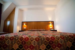 Postel nebo postele na pokoji v ubytování Hotel Bagoeira