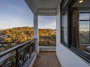 a balcony with a view of a city at Gold View Boutique Hotel Đà Lạt in Da Lat