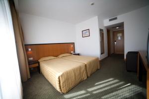 Postel nebo postele na pokoji v ubytování Hotel Bagoeira