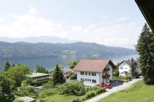 a view of a lake from a house at Pesentheinerhof in Millstatt