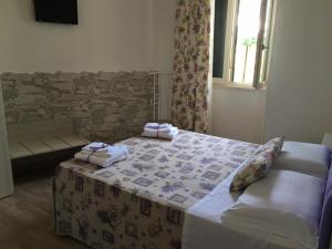 Postel nebo postele na pokoji v ubytování Messapia Casa Vacanze