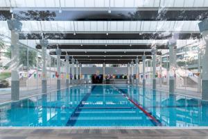 a large swimming pool in a building at חופשה חלומית in Caesarea +14 photos
