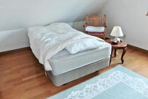 a bedroom with a bed and a table and a chair at Asahikawa - House - Vacation STAY 78092v in Asahikawa