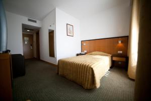 Postel nebo postele na pokoji v ubytování Hotel Bagoeira