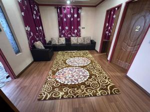 a room with a carpet with a couch and a door at ff HILLTOP VIEW in Kampong Kundassan +19 photos