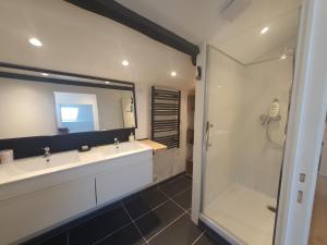 a bathroom with a mirror and a sink and a shower at Quiet house for 6 people with parking - 5 minutes from Timone University Hospital in Marseille +19 photos