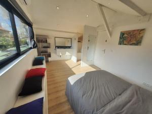 a bedroom with a bed and a large window at Quiet house for 6 people with parking - 5 minutes from Timone University Hospital in Marseille