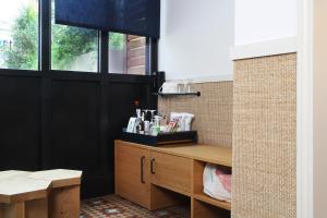a bathroom with black walls and a wooden counter at Hotel Casa Bonay & Spa in Barcelona