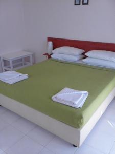Ένα ή περισσότερα κρεβάτια σε δωμάτιο στο Aprilis Apartments