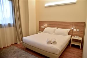 Postel nebo postele na pokoji v ubytování Hotel Forum + 37 fotografií