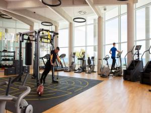 a group of people in a gym with machines at Apartment in Veli Losinj by the Sea in Veli Lošinj