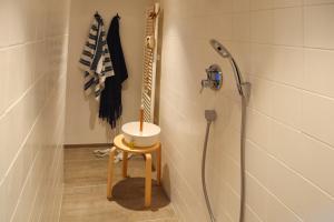 a bathroom with a shower with a sink in it at StrandHafen in Otterndorf