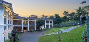 Un jardín fuera de The Feel Munnar Resort