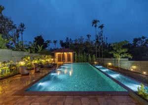 La alberca dentro o cerca de The Feel Munnar Resort