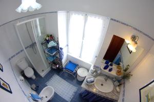an overhead view of a bathroom with a sink and a shower at Casa da Rainha in Calheta +38 photos