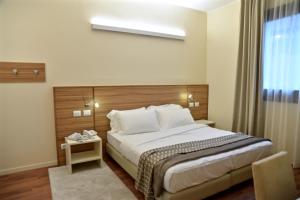 Voodi või voodid majutusasutuse Hotel Forum toas