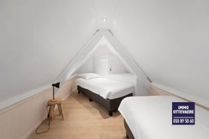 Ένα ή περισσότερα κρεβάτια σε δωμάτιο στο villa les champs de knokke