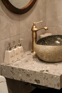 a bathroom with a sink and a counter top with a sink at Benny Homestay Huế in Hue +55 photos