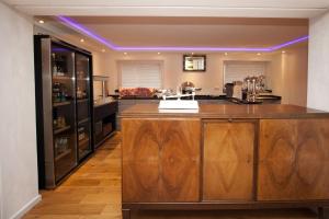 a kitchen with a large wooden island in a room at Hotel Vintage Am Bundesbank-Bunker in Cochem