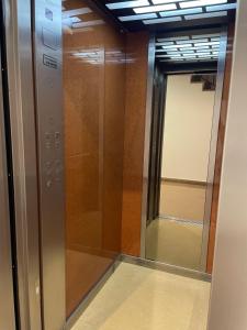 a elevator in a building with a mirror at Apartamento Lardero Garnacha Rioja in Lardero +27 photos