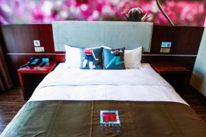 Katil atau katil-katil dalam bilik di Pai Hotel Tangshan Gangyao Road Hebei Bridge