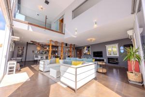 a living room with a couch and a table at Casa Alma by Escape Home in Tías