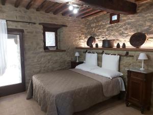 Postel nebo postele na pokoji v ubytování Villa L'Antico Mulino