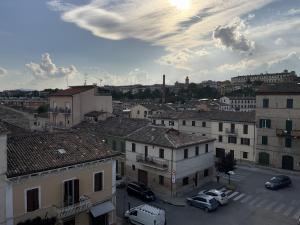 a view of a city with cars parked in a parking lot at Beb la terrazza in Iesi
