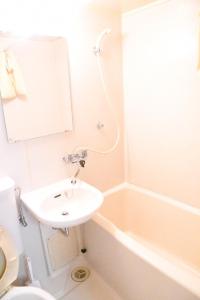 a bathroom with a sink and a toilet and a bath tub at Ueda Building - Vacation STAY 8554 in Asahikawa