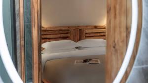 a small bedroom with two beds in a room at Nostalgia 28 lodge in Baisha +66 photos