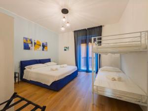 a bedroom with two bunk beds and a window at Lakeview Holiday Homen - Renovated apartment in the heart of Lovere with WiFi in Lovere
