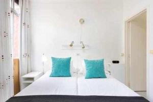 Katil atau katil-katil dalam bilik di Apartamento Playa San Juan WIFI
