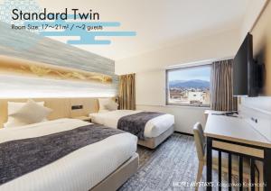 a hotel room with two beds and a desk at HOTEL MYSTAYS Kanazawa Katamachi in Kanazawa