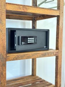 a microwave oven sitting on top of a shelf at Olzadia Boutique Hotel in Michamvi