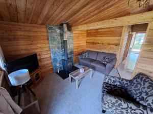 an overhead view of a living room with a couch and a fireplace at 87 Loch Murray in Creetown