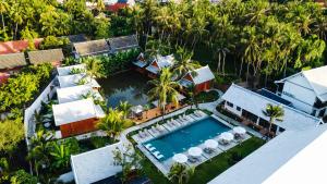 an aerial view of a house with a swimming pool at The Jam Boutique Hotel in Luang Prabang