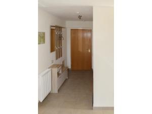 a hallway with a door and a tile floor at Apartment view of fortress in Pirna in Pirna +33 photos