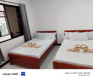 Katil atau katil-katil dalam bilik di Hadefe Cottages Beach Front