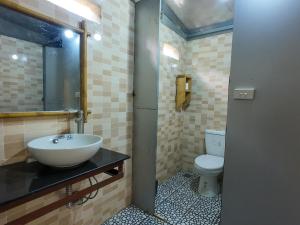 a bathroom with a sink and a toilet at Giay's Local House in Sapa