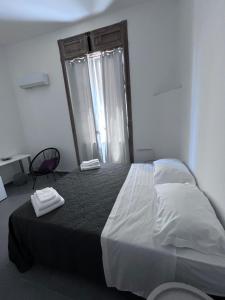 Postel nebo postele na pokoji v ubytování Residenza Margot Cosenza